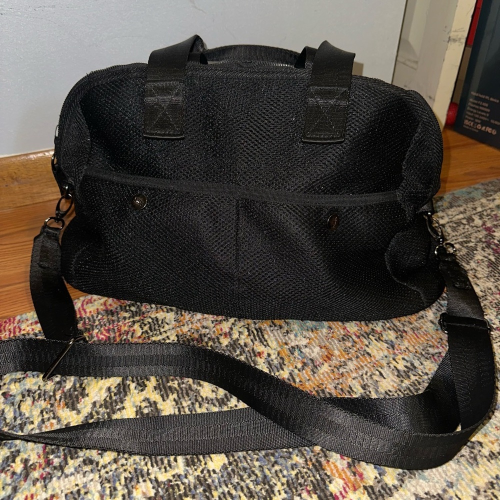 XIIX Black Travel Bag with Adjustable Strap and Structured Design